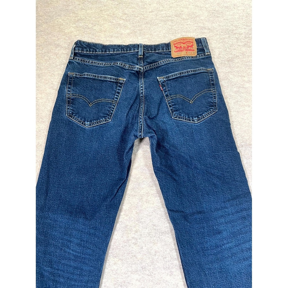 Levi's 502 Taper Fit Jeans Mens 34x32 Blue Whiskering Denim Medium Wash Mid Rise - Picture 8 of 16